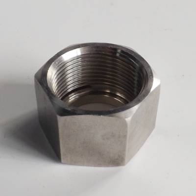 A hex jam nut on the gray background