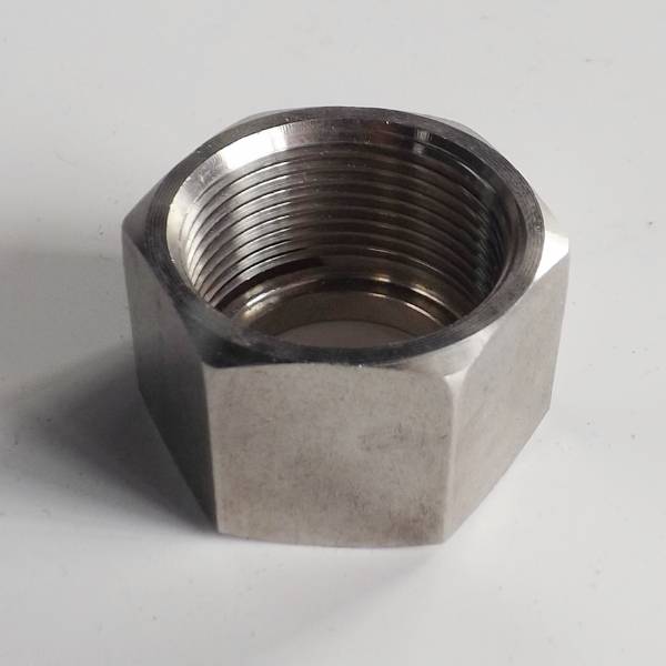 A hex jam nut on the gray background