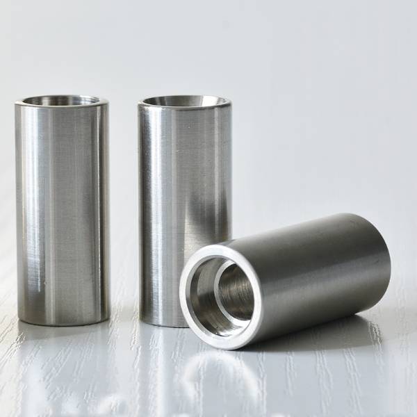 Three QLA-002 hose ferrules on table