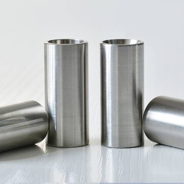 Four QLA-004 hose ferrules on table